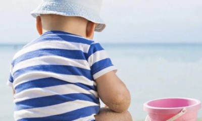 How should children be protected from the sun?